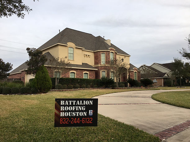 Completed roof replacement on a large brick home in the Houston area