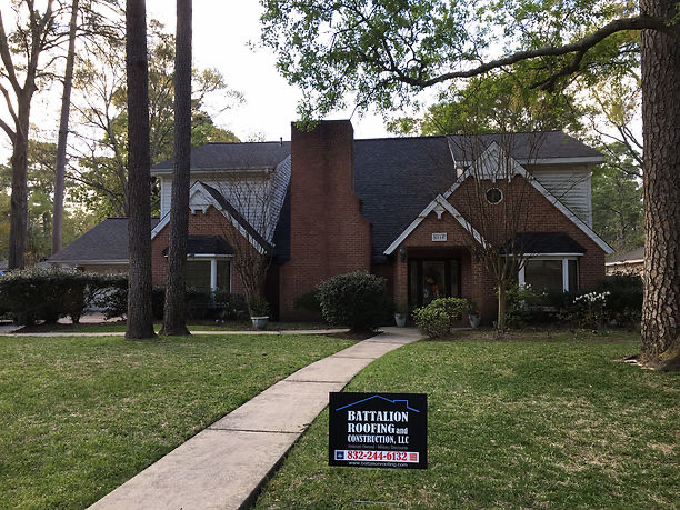 New roof on a two-story brick home in the Houston area
