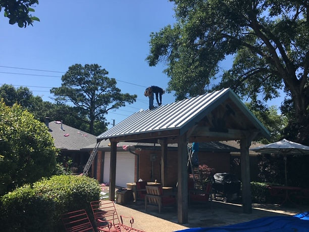 Standing-seam metal roof on a backyard pavilion in Houston
