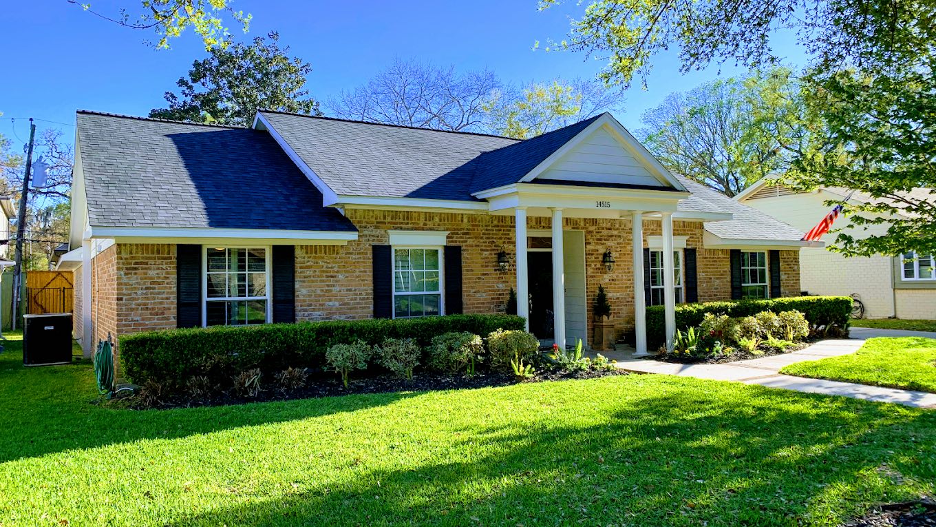 New asphalt shingle roof on a brick home in the Houston, Texas area
